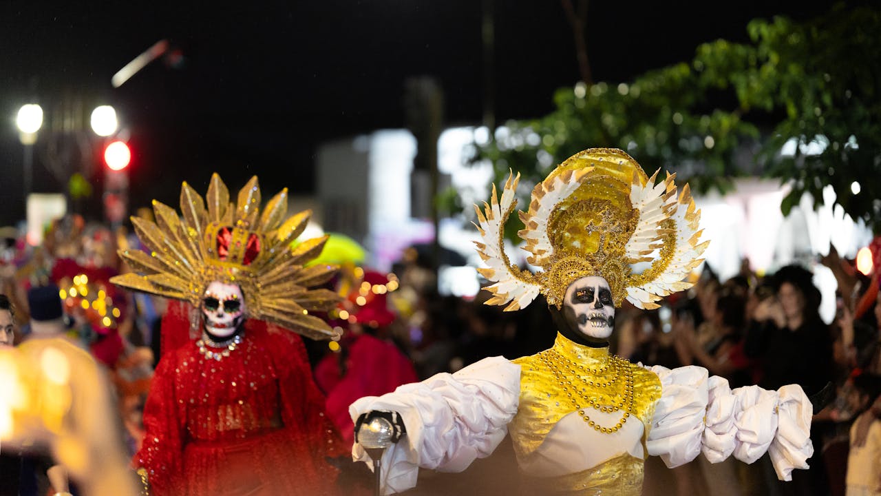 Vibrant Dia de los Muertos parade in Merida, Yucatan, showcasing traditional costumes and cultural richness.