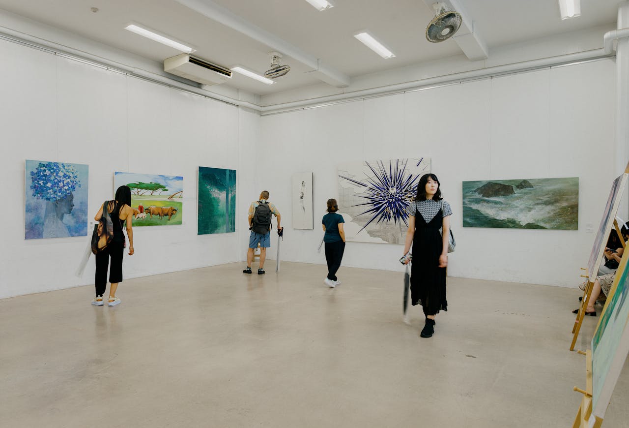 Explore diverse artworks in a contemporary Tokyo gallery setting.